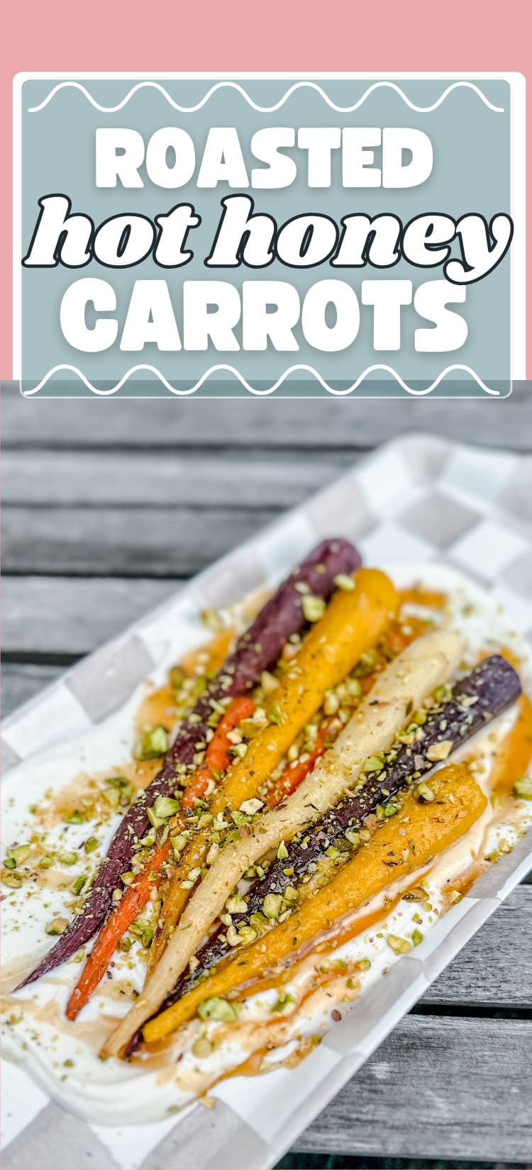 A plate of colorful roasted carrots drizzled with hot honey and sprinkled with crushed pistachios, served on a white tray. The text above reads Roasted Hot Honey Carrots.