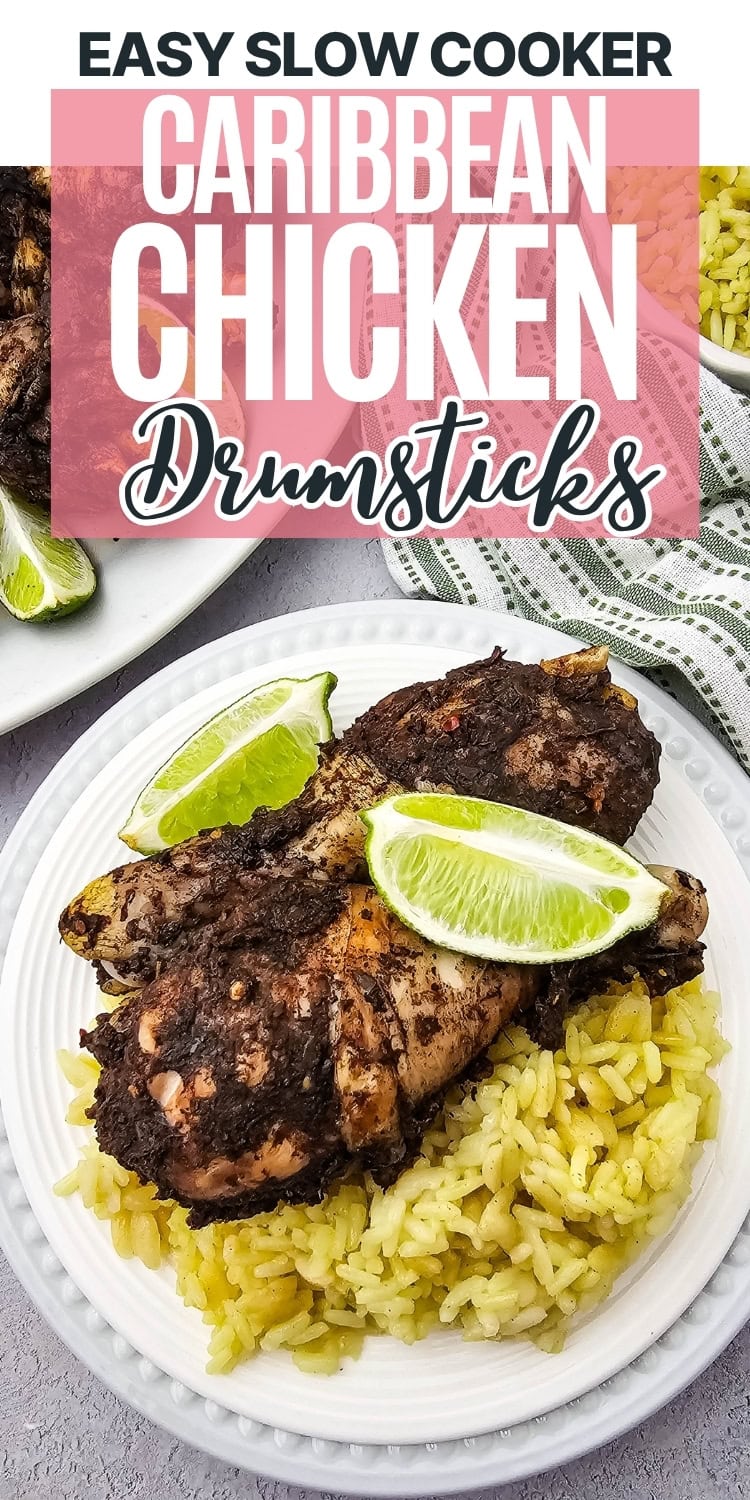 A white plate with two seasoned chicken drumsticks on yellow rice, garnished with lime wedges. Text above reads Easy Slow Cooker Caribbean Chicken Drumsticks. A fork and napkin are beside the plate.