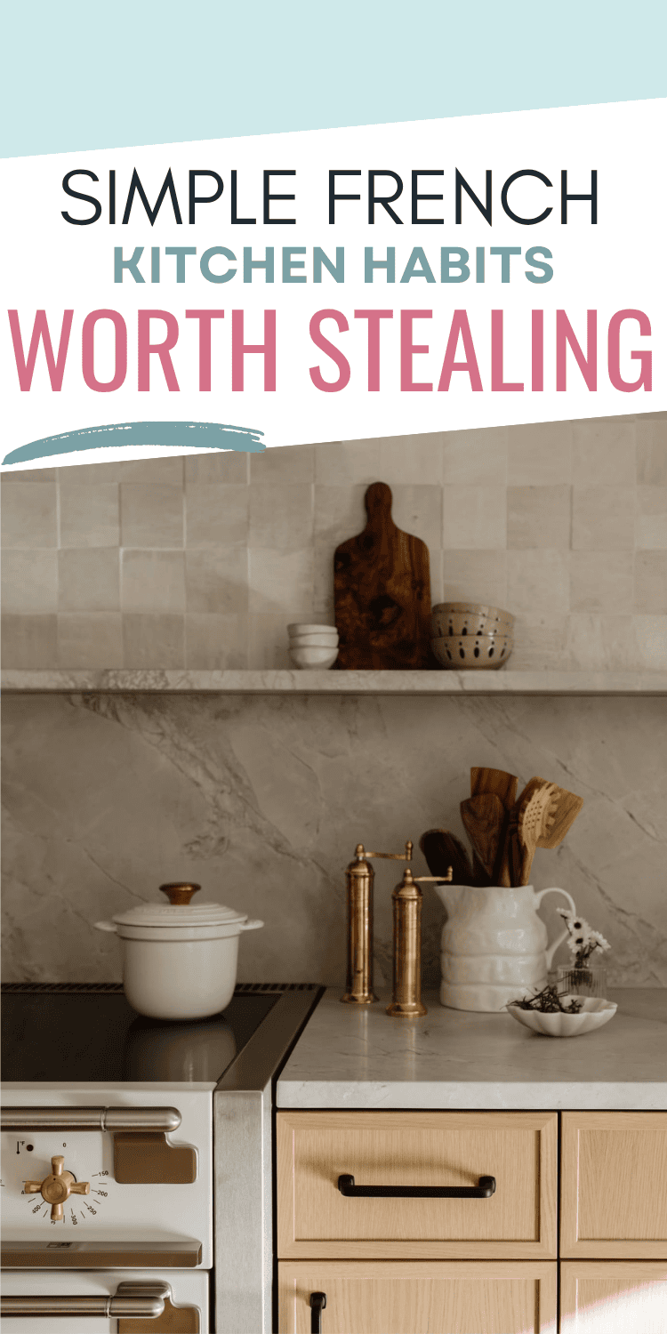 A modern kitchen with light wood cabinets, a white stove, a white pot, gold salt and pepper mills, a white vase with wooden utensils, and simple decor on a shelf. Text reads: Simple French kitchen habits worth stealing.