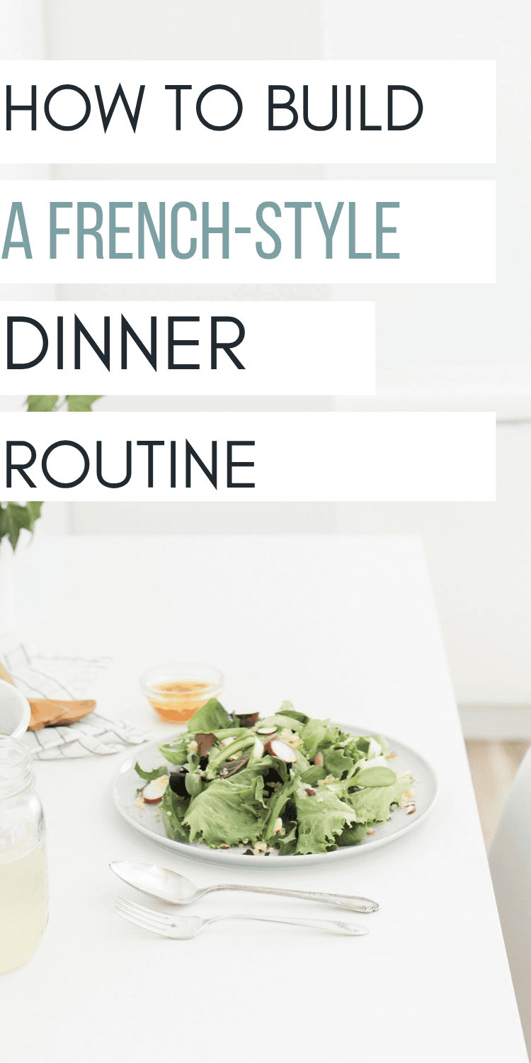 A white table with a plate of salad, a glass of lemonade, and a small dish of dressing. Overlaid text reads, How to build a French-style dinner routine.
